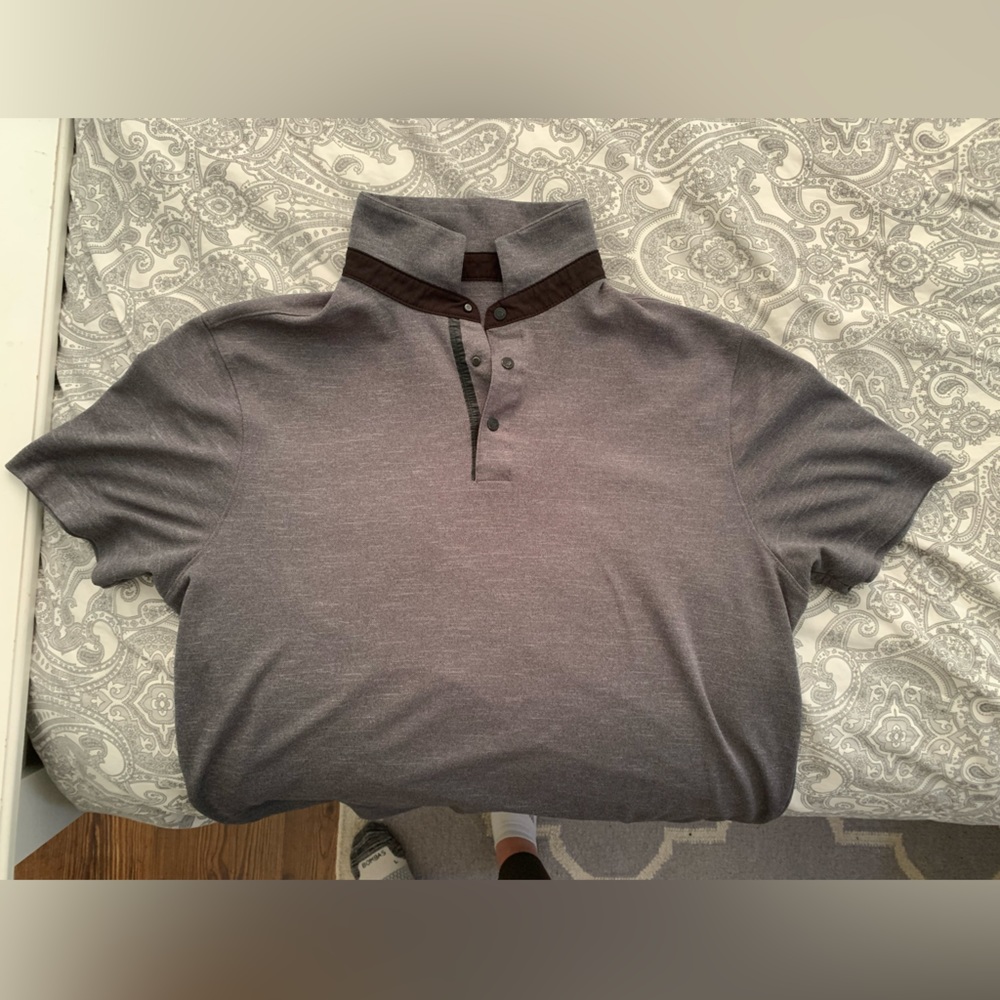 Multiple athletic shirts with various logos